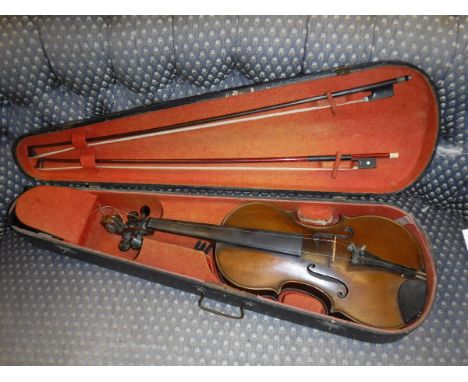 A violin bearing Stradivarius label to interior, together with two various bows in an ebonised wooden case   CONDITION REPORT