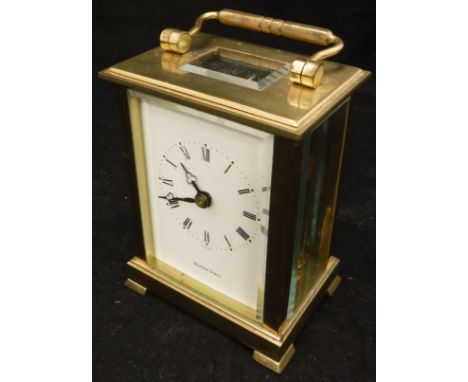 A five glass brass mantle clock with white enamel dial set with Roman numerals inscribed ""Shortland Bowen"" to face