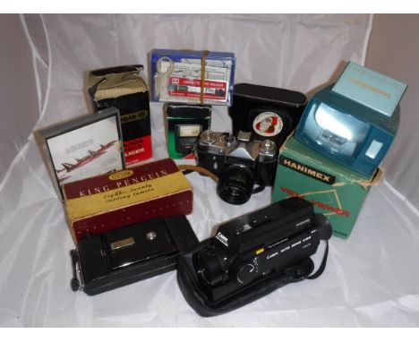 A box of various camera equipment to include a King Penguin camera, slide viewer, JVC Camcorder etc