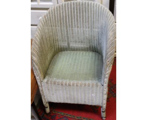 A pine trunk emblazoned with the initials "R.O.S", together with a Lloyd Loom style armchair and linen basket and a small col