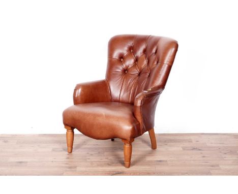 A Derwent leather button-back tub armchair, with oak feet, upholstered in a brown leather, 63 x 73 x 83cms high.