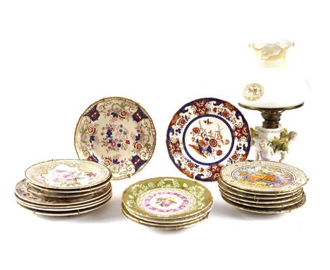 A collection of Masons and Coalport wall plates; together with a continental oil lamp, its body decorated with putti, with a 