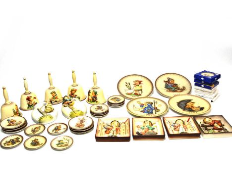 A collection of Goebel Hummel decorative plates, bells, and wall plaques, including: bells for the years 1978-1980, 1983, and