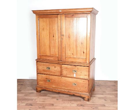 A Victorian pine linen press, with ogee moulded cornice, above two cupboard doors, opening to reveal an interior fitted with 