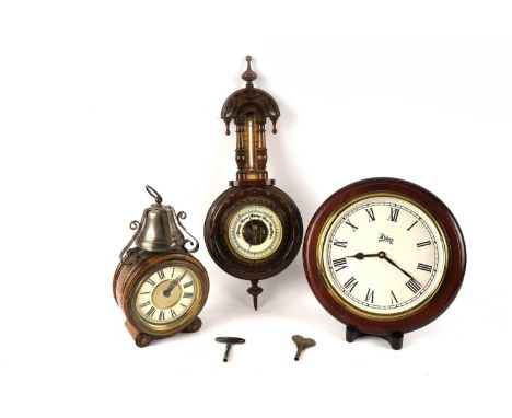 A Victorian style oak barometer, together with; a 20th Century oak-cased alarm clock, with white Roman chapter ring and brass