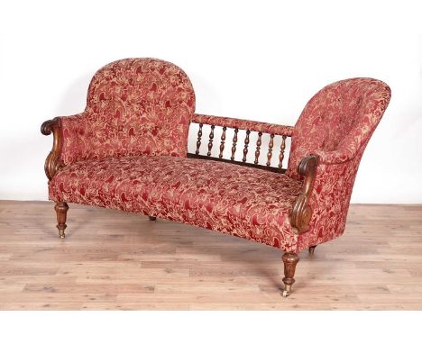 A Victorian rosewood button-back concave fronted sofa, with turned spindle back, carved scroll arms, raised on turned legs, u