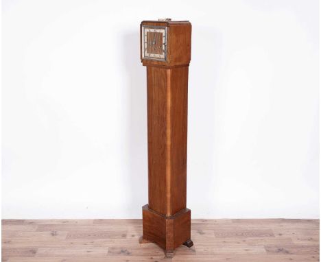 Kienzle: an Art Deco walnut longcase clock, with silvered chapter ring, three train movement, with assortment of chimes, stri