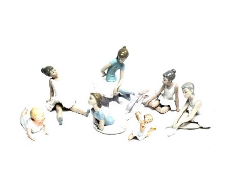 A selection of Lladro and other decorative ceramic figures of ballerinas, most modelled seated, the tallest 22cms; together w