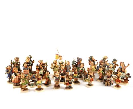 A collection of Goebel Hummel figures, including: 403 ‘An Apple a Day’; 72 ‘Spring Cheer’; 201 ‘Retreat to Safety’; 308 ‘Litt