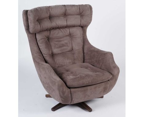 Parker Knoll: A 'Statesman' armchair upholstered in a light brown plush material, 80 x 82 x 102cms high.