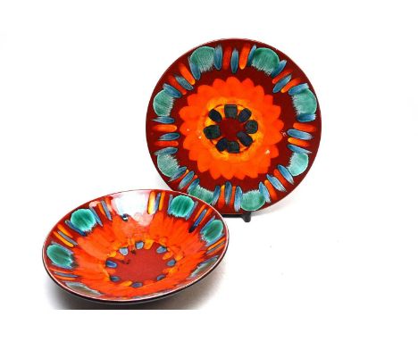 A Poole Pottery ‘Volcano’ pattern bowl, 34cms diameter; together with a Poole Pottery ‘Volcano’ pattern charger, 41cms wide. 