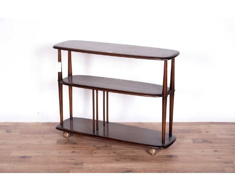 A stained elm dark Ercol trolley, with three tiers and spindle supports, on metal castors, 91 x 32 x 71cms high.