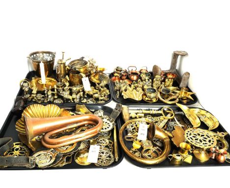 A collection of 19th century and later brassware, including: horse brasses; pan stands; a candle holder; a button slide; and 