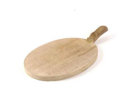 An oak Robert ‘Mouseman’ Thompson Cheeseboard, with mouse figure in high relief, 40cms.
