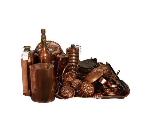 A selection of 20th Century copper jelly moulds, including: an oval mould, with relief decoration of fruit to its top, 34cms 