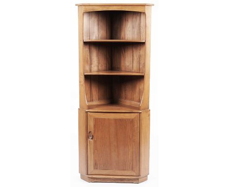 Ercol: a light elm 'Windsor' corner cabinet with open shelves above and cupboard below, 76 x 52 x 79cms high.