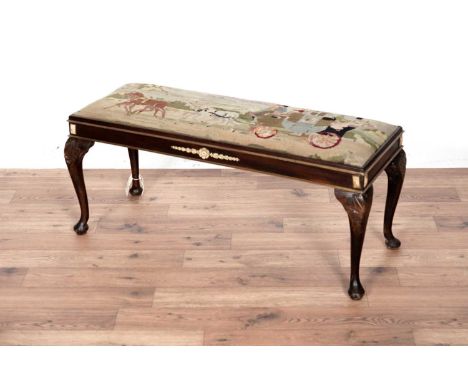 A Victorian oak foot stool, the seat pad with tapestry upholstery of a horse drawn cart, with simulated bone floral and folia