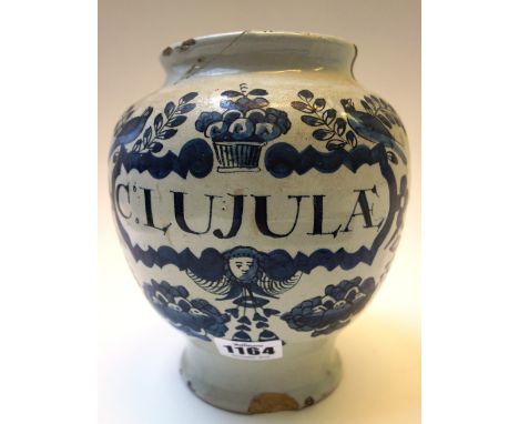 An English delftware dry drug jar, 18th century, detailed C: LUJULAE in blue against an off white ground (a.f.) 17cm high. 