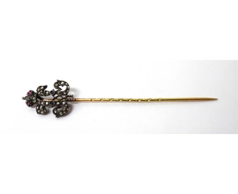 A Russian gold and silver, rose diamond, ruby and sapphire set stick pin, designed as a royal monogram with a crown surmount,