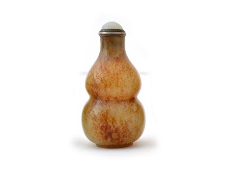 A Chinese jade snuff bottle, probably first half 19th century, the stone of greyish brown tone with russet inclusions, archai