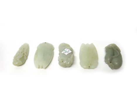 Five Chinese pale celadon jade carvings, comprising; a peapod pendant; an eggplant; a bird in branches pendant and two cicada