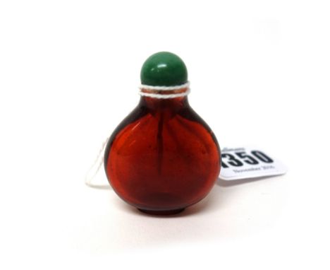 A small Chinese ruby glass snuff bottle, of pear form, well hollowed, 4cm.high.