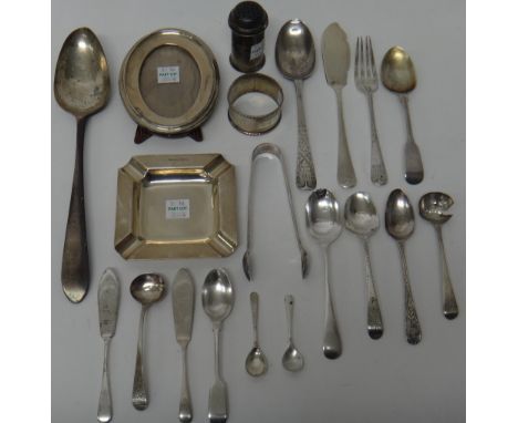 Silver and silver mounted wares, comprising; a square ashtray, an oval photograph frame, a napkin ring, a pepperette, two mus