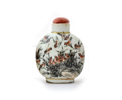 A Chinese porcelain snuff bottle, late 19th/early 20th century, each side painted in brown and black with sparrows, red paint