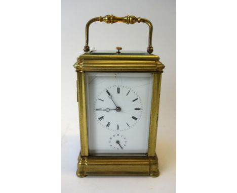 A French gilt brass cased carriage clock, late 19th century, with push hour repeat and subsidiary alarm dial, the two train m
