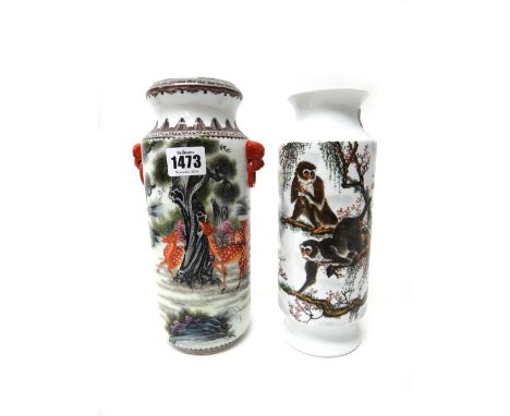 A Chinese porcelain cylindrical vase, 20th century, painted with deer in a landscape, the reverse with calligraphy, apochryph