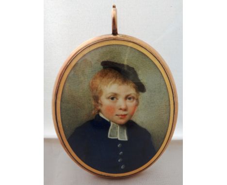 An early 19th century English school portrait miniature on ivory of a young boy in blue coat with large white buttons and wea