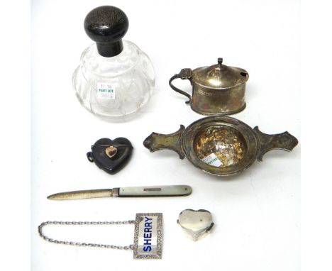 A group of silver and silver mounted wares, comprising; a European twin handled strainer, a silver lidded glass scent bottle,