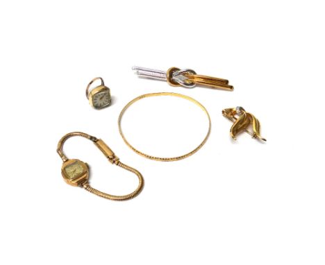 A gold bangle, with faceted decoration, a lady's 9ct gold Accurist bracelet wristwatch with a Brazil link bracelet, a lady's 