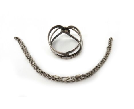 A Sterling silver oval hinged bangle, in an openwork design, detailed Sterling, a circular bangle, detailed 800 and a ropetwi