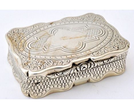 A Victorian silver shaped rectangular hinge lidded snuff box, with a floral moulded thumbpiece, otherwise with engraved decor