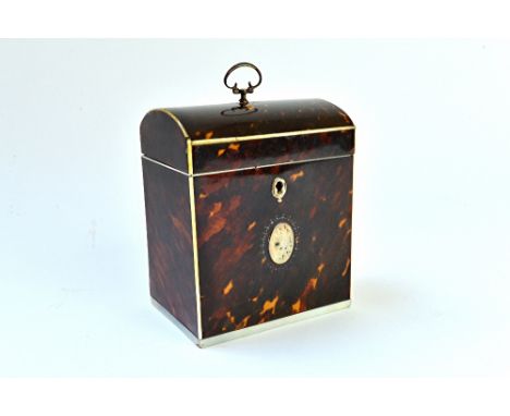 A George III ivory and silver mounted tortoiseshell tea caddy, with dome top and loop handle, 9cm wide x 11cm high. Illustrat