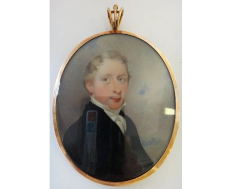 A good early 19th century English School portrait miniature on ivory of Ensign Robert Alexander, depicted in front of a finel