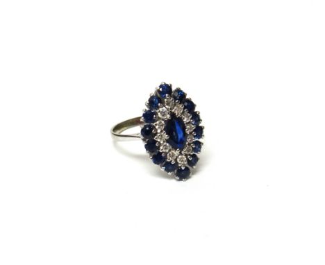 A 14ct white gold, sapphire and diamond marquise shaped cluster ring, mounted with the principal marquise sapphire at the cen