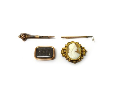 A gold brooch, designed as a golf club, mounted with a seed pearl, detailed 15, a Victorian oval shell cameo brooch carved as