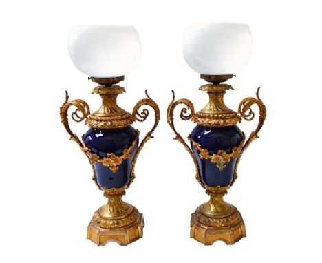 A pair of French porcelain and gilt metal vase lamps, late 19th century, each two handled baluster lamp now adapted to electr