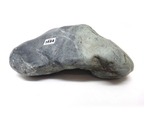 A large uncarved jade boulder, the stone of bluish grey, green and white tones, 31cm. wide, weight 22lbs ( 9979 grams).