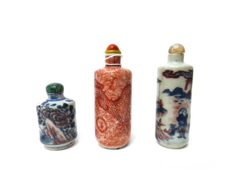 A Chinese porcelain cylindrical snuff bottle, late 19th/20th century, painted in iron-red with a dragon amongst foliage, red 