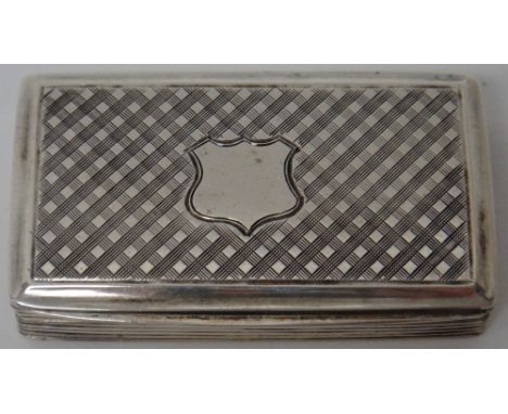 A Victorian silver rectangular hinge lidded snuff box, decorated with reeded sides and with a vacant shield shaped cartouche 