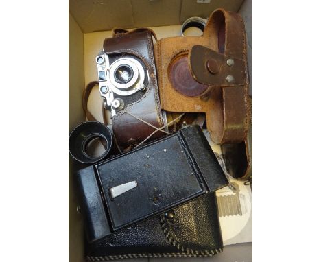 A Leica D.R.P. vintage camera, serial number 339111, cased, with accessories.