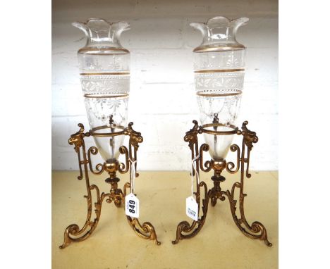 A pair of glass and enamel decorated vases, early 20th century, mounted in gilt metal triform frames, each with lion mask dec