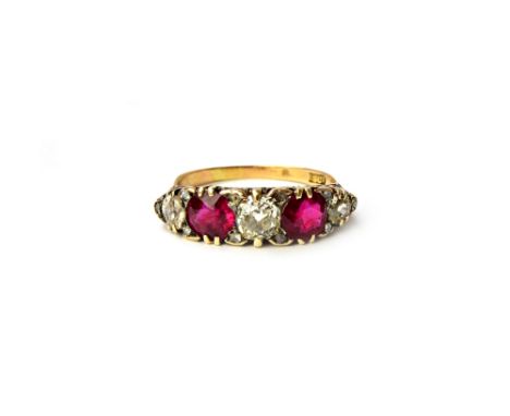 A gold, ruby and diamond five stone ring, mounted with three cushion shaped diamonds alternating with two cushion shaped rubi