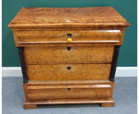 A 19th century Biedermeier birch commode, the four drawers flanked by ebonised turned columns, on block feet, 95cm wide.