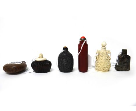 A group of six Chinese snuff bottles, 19th/20th century, comprising; a wood bottle carved as a human's shoulders; a grey and 