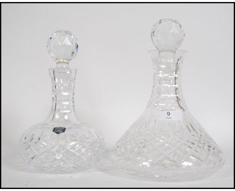 Two vintage 20th century lead cut glass crystal decanters, both with matching stoppers and marked to the base Stuart. The tal