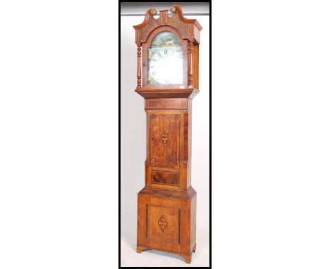 A 19th Century inlaid country oak welsh longcase clock by J Thomas of Carmarthen. The arch shaped hood with glazed door havin